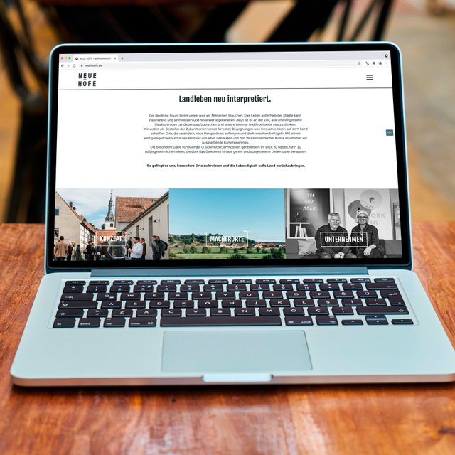 Die Webseite "Neue Höfe" ist auf einem Laptop zu sehen. 