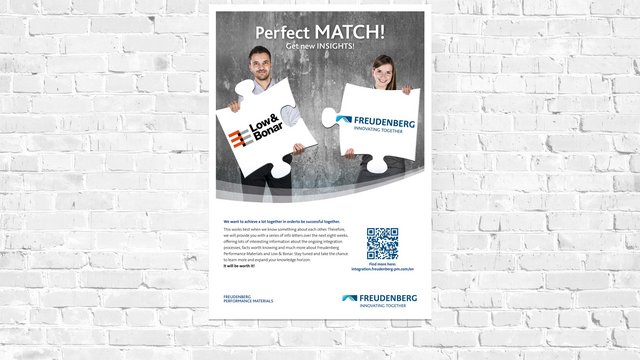 Poster der Integrationskampagne hängt an der Wand