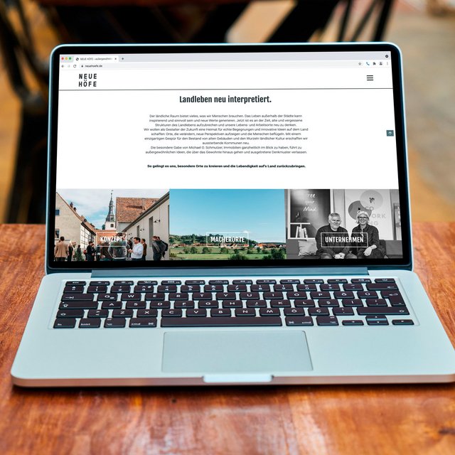 Die Webseite "Neue Höfe" ist auf einem Laptop zu sehen. 