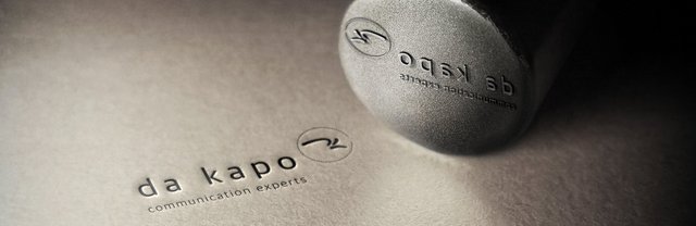 Prägestempel da kapo mit Abdruck auf Papier